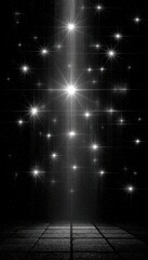 Vertical bright light amidst many twinkling stars on a dark scene