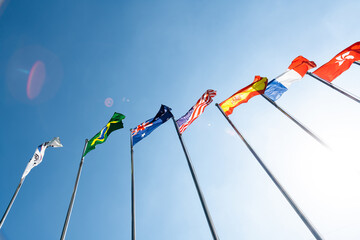 Flags of different countries in the sky