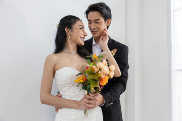 Bride groom wedding bouquet romantic couple love happiness formal celebration elegant joyful white...