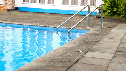 Stainless steel swimming pool ladder.
