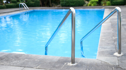 Stainless steel swimming pool ladder.