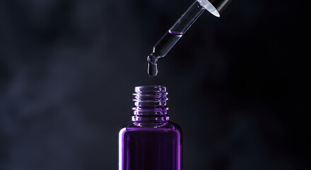 Purple liquid dripping into a glass cosmetic bottle demonstrates serum application on a dark backdrop.