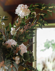 Flower decoration compositions indoors. Selective focus. Prepared for decorating rooms for celebrations.