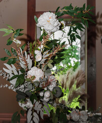 Flower decoration compositions indoors. Selective focus. Prepared for decorating rooms for celebrations.