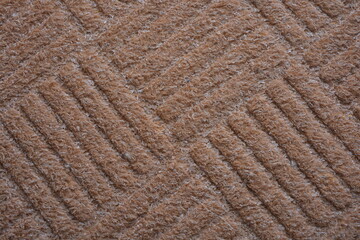 Synthetic thread backgrounds. Structured, textured brown woven rug with linear pattern and bristles...