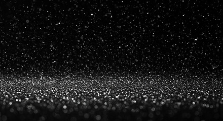 Obraz premium Shimmering silver particles creating a sparkling bokeh light effect on a dark abstract background