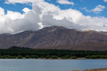 Tranquil Lake Surrounded by Majestic Mountains
