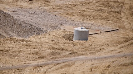 cement base to a light post at a construction site