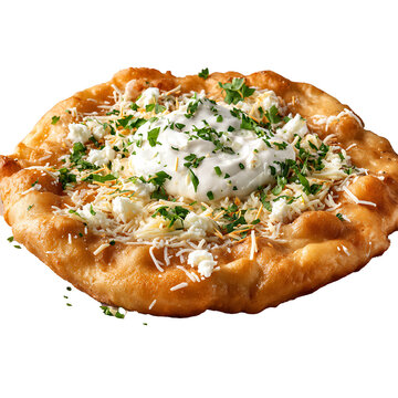 A close up shot of langos topped with sour cream cheese and parsley on a black background
