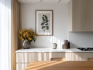 Fototapeta premium A kitchen with a white counter and a vase of flowers on it. A framed picture of a leaf is on the wall