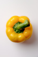 Fresh sweet yellow bell pepper on white background.