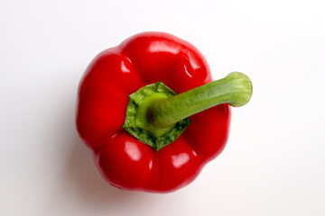 Fresh sweet red bell pepper on white background.