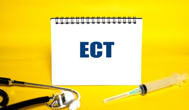 "ECT" written on a white notepad with a bright yellow background, accompanied by a medical stethoscope.
