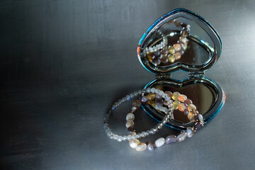 Beautiful agate and labradorite bead bracelets, their natural beauty reflected in a heart-shaped...