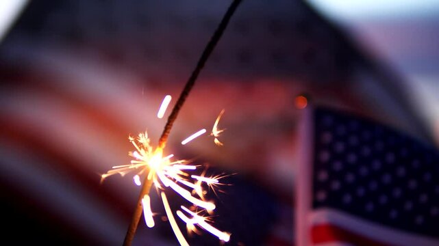 Happy 4th of July, Independence Day, sparklers, Fireworks Celebration. USA American flag waving sunset outdoor dark background. Concept fourth of July, 4th of July, USA, Freedom, Independence Day