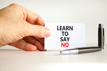 Learn to say no symbol. Concept words phrase Learn to say no on beautiful white card. Businessman's...