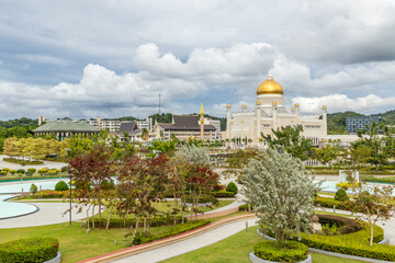 City central garden of Omar Ali Saifuddien Mosque golden domes and minarets with downtown in the background, Bandar Seri Begawan, Borneo, Sultanate Brunei Darussalam