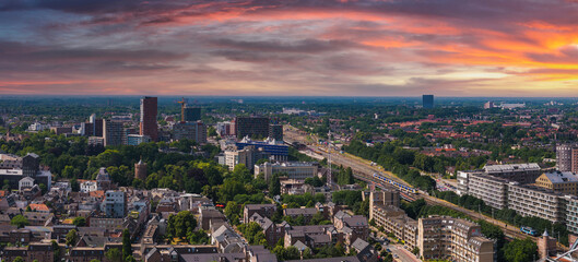 Aerial view of Nijmegen, Netherlands, during sunset. Features historic and modern buildings, a...