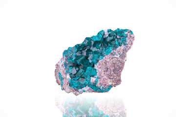 Dioptase. Specimen from Tsumeb Mine, Namibia. photography isolated on white blackground. macro detail background. close-up mineral crystal unpolished semi-precious gemstone.