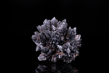 Descloizite. Specimen from Berg Aukas, Namibia. photography isolated on black background. macro detail close-up mineral crystal unpolished semi-precious gemstone.
