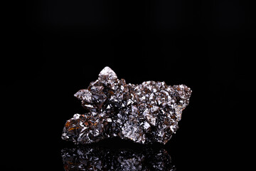 Descloizite brown crystals. Specimen from Berg Aukas, Namibia.  photography isolated on black background. macro detail close-up mineral crystal unpolished semi-precious gemstone.
