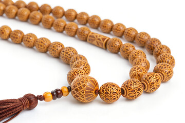 Obraz premium Close-up of intricately carved wooden prayer beads, mala, for meditation