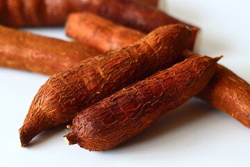 Tapioca also known as cassava roots or yuca or manioc, on a clean white background