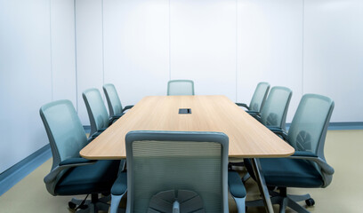 Meeting room with big table and armchair