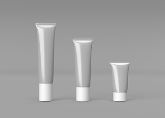 Three Gray Cosmetic Tubes Mockup Different Sizes for Branding and Packaging Design