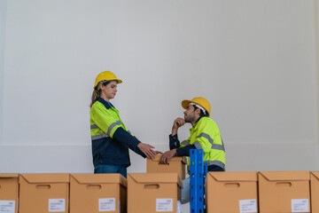 Warehouse worker working in warehouse storage. Foreman or worker work at factory site check up...