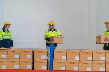 Warehouse worker working in warehouse storage. Foreman or worker work at factory site check up...