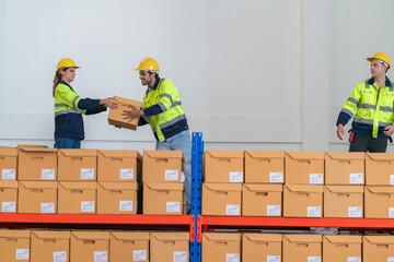 Warehouse worker working in warehouse storage. Foreman or worker work at factory site check up...