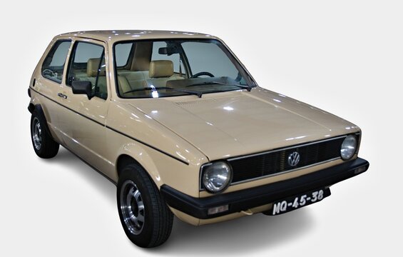 Beige Volkswagen Golf Mk1 posing in studio