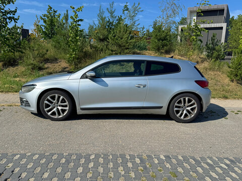 Almere, the Netherlands - June 29, 2025: Volkswagen Scirocco coupe parked on a public parking lot. Nobody in the vehicle.