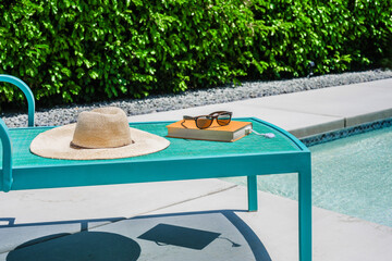Hat and book on lounge chair in Palm Springs