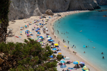 Turquoise Waters and Sunbathers on a Crowded Mediterranean Beach