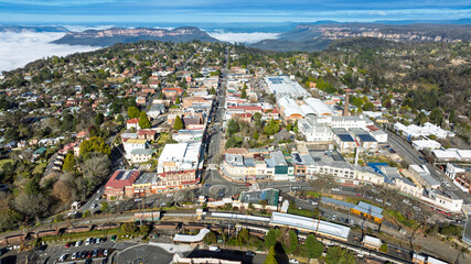 Drone aerial photograph of the picturesque and tourism town of Katoomba and the Jamison Valley full of low level clouds in the Blue Mountains, NSW, Australia.