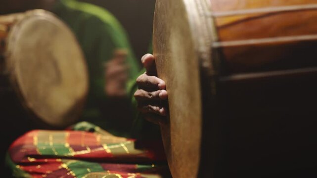 Hands Energetically Beating a Traditional South Sulawesi Drum &ndash; Cultural Rhythm and Performance