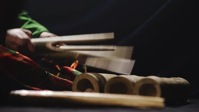 Close-Up of Hands Energetically Beating a Bamboo Drum from South Sulawesi &ndash; Traditional Rhythm and Cultural Expression
