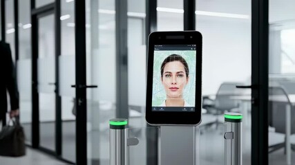 Biometric face recognition system with a woman passing through office entrance for secure access footage.