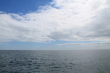 A Seascape of Sky Clouds Over an Open Ocean Sea.