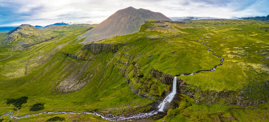 Aerial drone view of a waterfall Bjarnarfoss in Snaefellsnes Peninsula.