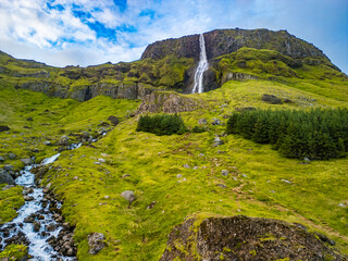 Aerial drone view of a waterfall Bjarnarfoss in Snaefellsnes Peninsula.