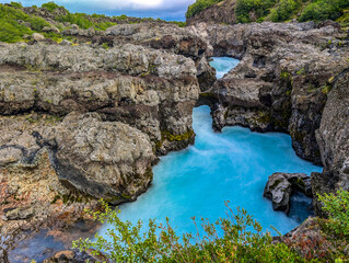 Aerial drone view of Barnafoss and Hraunfossars waterfall in west Iceland