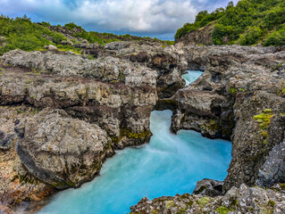 Aerial drone view of Barnafoss and Hraunfossars waterfall in west Iceland