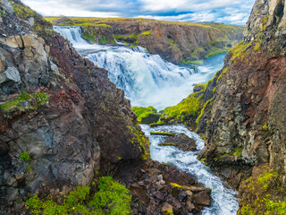 Aerial drone view of Fosslaug waterfall, Iceland