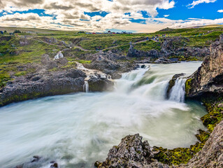 Godafoss waterfall with colorful sunset sky in summer at Iceland