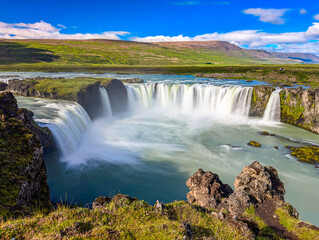 Godafoss waterfall with colorful sunset sky in summer at Iceland