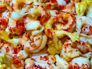 Close-up of cooked crayfish tails, showcasing their rich texture and vibrant red-and-white colors. Perfect for culinary, seafood, or gourmet-themed uses