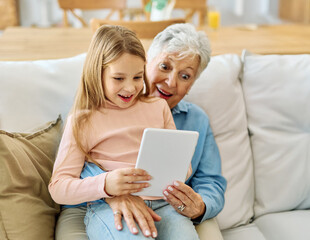 Family grandmother and grandchildren granddaughter girl, having fun using tablet at home